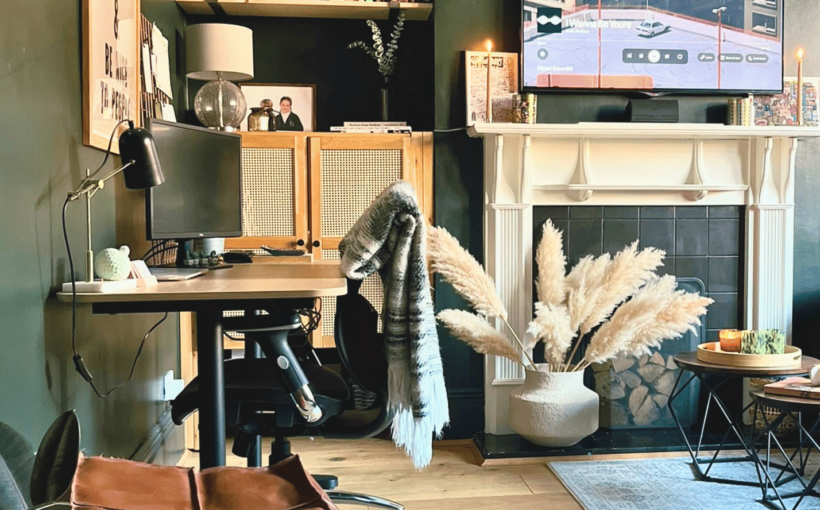 Cover Image of a transformed living room into a multi-functional home office with dark green walls and a workspace